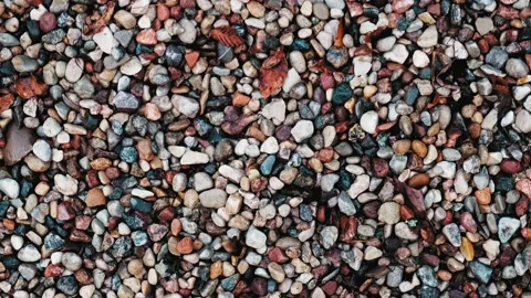 Tiny Stones Pebble Rocks Background Top View Dolly Video stock 165588489
