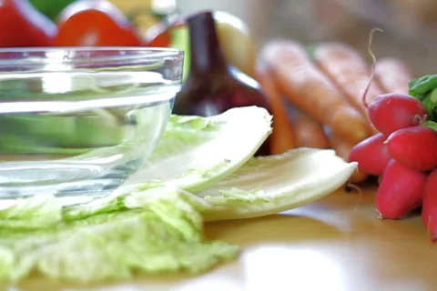 Tiny tomatoes falling into the bowl, dolly shot, shot at 60fps Video stock 777467