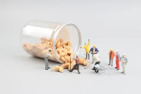 Tiny toy mining nuts with bottle Foto stock