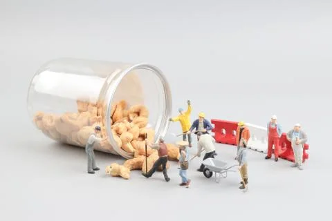 Tiny toy mining nuts with bottle Foto stock