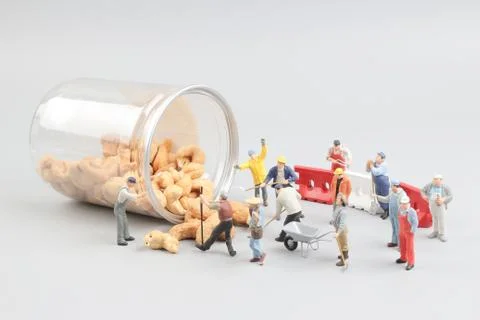Tiny toy mining nuts with bottle Foto stock