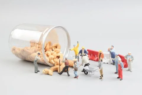 Tiny toy mining nuts with bottle Foto stock