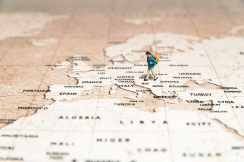 Tiny traveler model walk on map Stock-Fotos