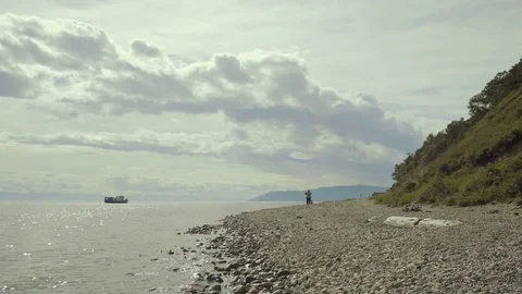 A tiny tugboat moves in the waters of Lake Baikal in summer Stock Footage 81042817