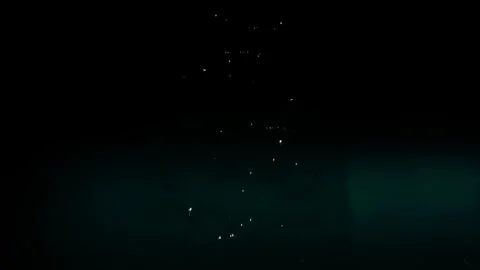 Tiny Water Droplets Floating In Dark Underwater Scene Stock Footage 339301734