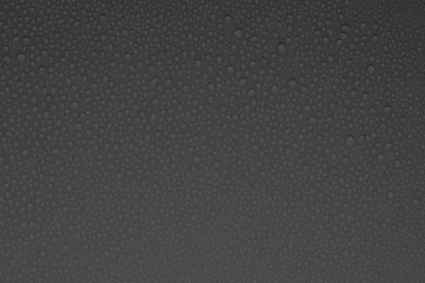 Tiny water droplets on grey background as dew or spray pattern with soft matt Stock Photos