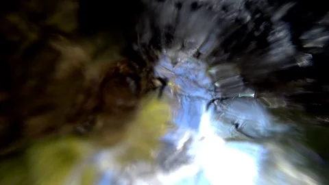 Tiny waterfall from below Stock Footage 112767537