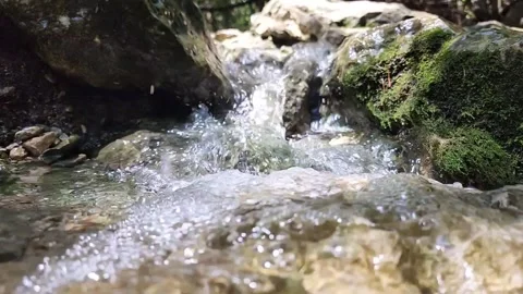 Tiny waterfall with crystal clear water Stock Footage 277660245