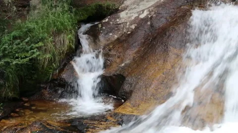 Tiny Waterfall Next to Water Flowing Over A Boulder  Stock Footage 41270248