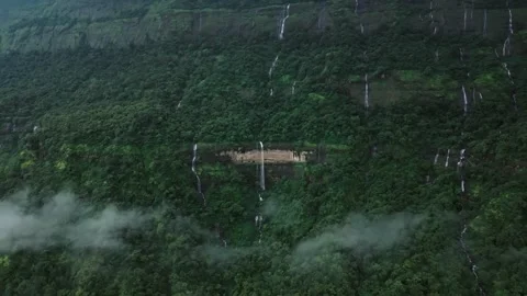 Tiny Waterfall in Vast Green Forest – High Aerial Drone View Stock Footage 285926850