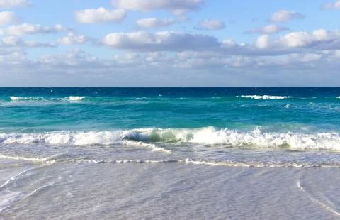 Tiny waves on the beach of the Caribbeans Stock Photos
