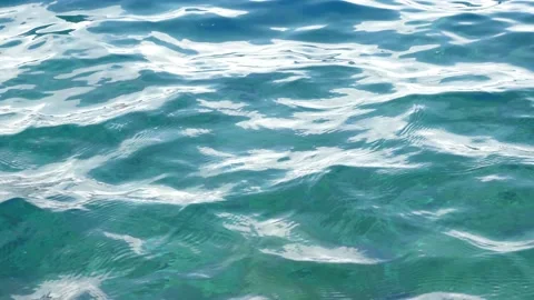 Tiny waves on the calm sea. The surface of the sea is very smooth. Blue clear 스톡 동영상 153742200