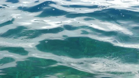 Tiny waves on the calm sea. The surface of the sea is very smooth. Blue clear 스톡 동영상 153742363