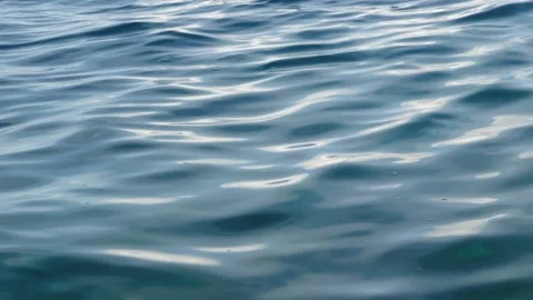 Tiny waves on the calm sea. The surface of the sea is very smooth. Blue clear 스톡 동영상 153743204