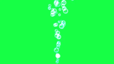 Tiny white bubbles rising in a stream against a vibrant green screen backgrou Stock Footage 345620239
