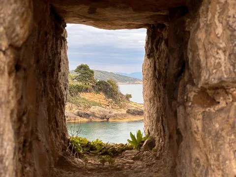 Tiny window in the fortress wall Stock Photos