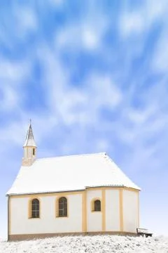 Tiny winter church or single snowbound small chapel Stock Photos