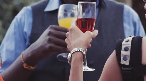 Tiny woman’s hand holding a glass of red wine during the party Stock Footage 66544126