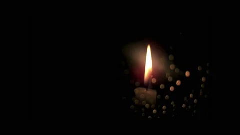 Tip of candle with burning wick on black background, with bokeh effect, 4k Stock Footage 237065678