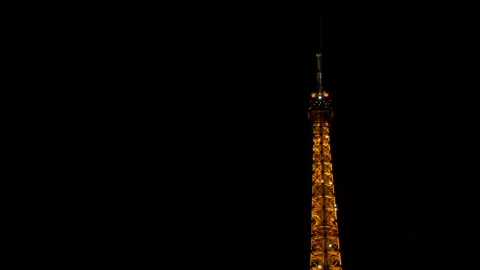 Tip of the Eiffel Tower Illuminated at Night. City of Paris. Slow Motion 4K 库存影片 297751454