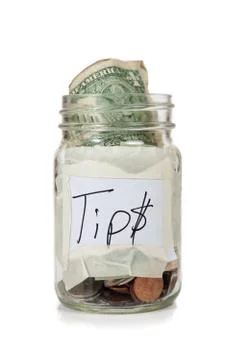 Tip jar with money Stock Photos