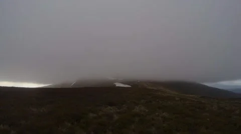 Tip of the Mountain Absorbed by Thick Clouds Panorama From Left to Right Stock Footage 63950037