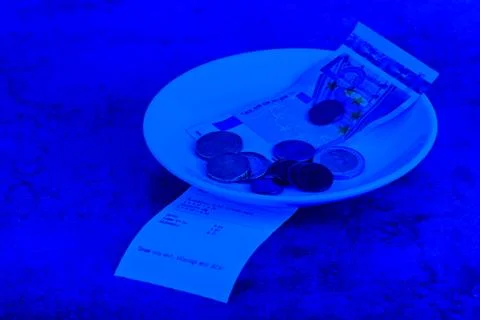 Tip on a restaurant table. Blue toned. 스톡 사진