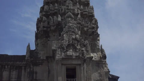 Tip of temple in angkor blue sky tilt up Stock Footage 226874216