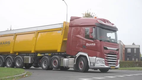Tipper Truck Navigating Dutch intersection Tracking Shot Vídeos de archivo 346882736