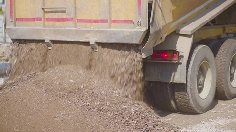 https://images.pond5.com/tipper-truck-unloading-gravel-road-footage-105582543_iconl.jpeg
