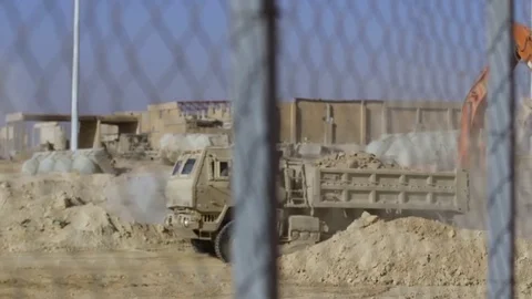 Tipper truck at work in Base al Qaim, Iraq Stock Footage 84676388