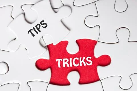 Tips and Tricks. Missing Piece Jigsaw Puzzle with word Stock Photos