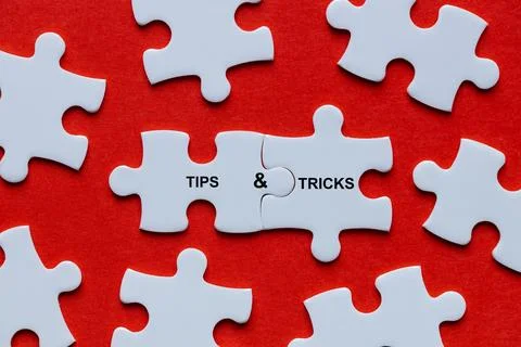Tips and tricks symbol. Among the scattered puzzle pieces Stock Photos