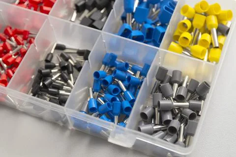 Tips of different sizes and colors for crimping stranded electrical wires. Wi Stock Photos