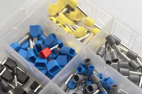 Tips of different sizes and colors for crimping stranded electrical wires. Wi Stock Photos