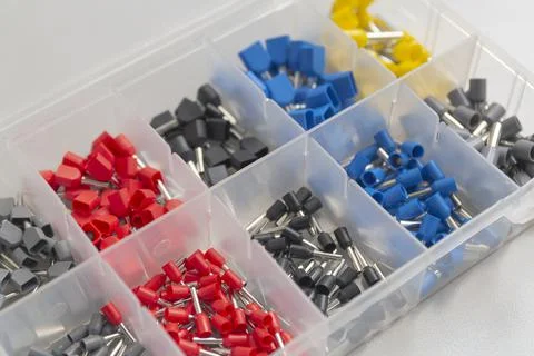 Tips of different sizes and colors for crimping stranded electrical wires. Wi Stock Photos