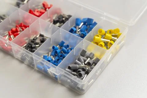 Tips of different sizes and colors for crimping stranded electrical wires. Wi Stock Photos