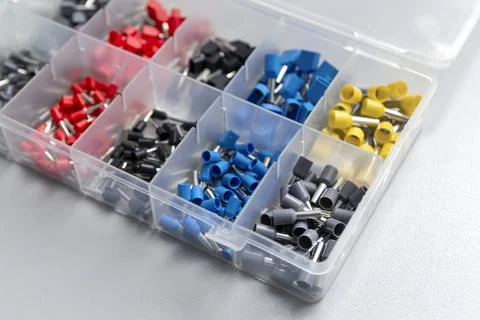 Tips of different sizes and colors for crimping stranded electrical wires. Wi Stock Photos