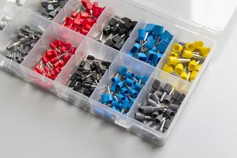 Tips of different sizes and colors for crimping stranded electrical wires. Wi Stock Photos