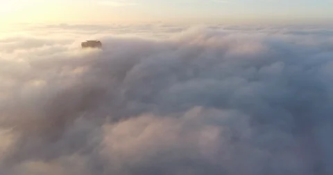 The tips of downtown LA break the low fog at sunrise Stock Footage 88189040