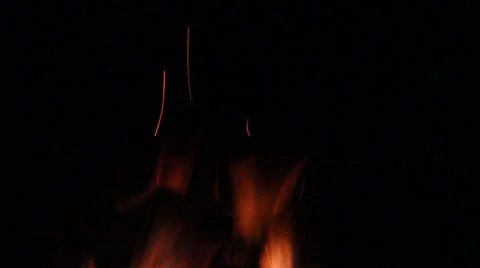 Tips of a fire lick the bottom of the frame Stock Footage 40206013