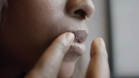 Tips for lip balm application using fingers for healthy soft lips Stock Footage 312471836