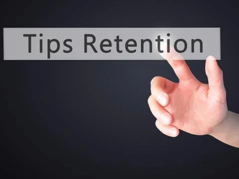 Tips Retention - Hand pressing a button on blurred background concept . Busin Foto stock