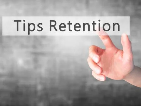 Tips Retention - Hand pressing a button on blurred background concept . Busin Stock Photos