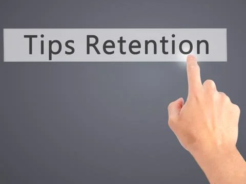 Tips Retention - Hand pressing a button on blurred background concept . Busin Foto stock