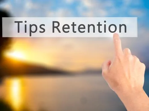 Tips Retention - Hand pressing a button on blurred background concept . Busin Foto stock