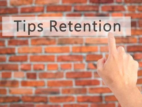 Tips Retention - Hand pressing a button on blurred background concept . Busin Foto stock