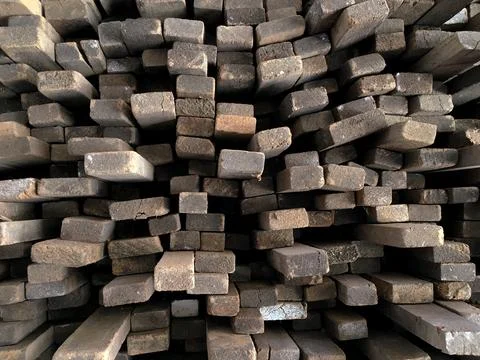 Tips of wooden boards placed in a pattern in a timber warehouse. Wood concept Stock Photos