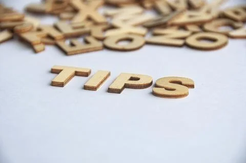 Tips wooden text on while cover background. Tips concept Foto stock