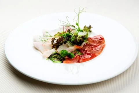 Tiraditos (black cod, tuna, halibut) with jalapeno and kimchi sauce Stock Photos